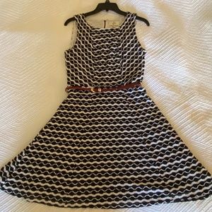 Knitted black and white overlayed onto a white dress w/ a burgundy red thin belt